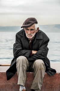 Loneliness-old man by bay