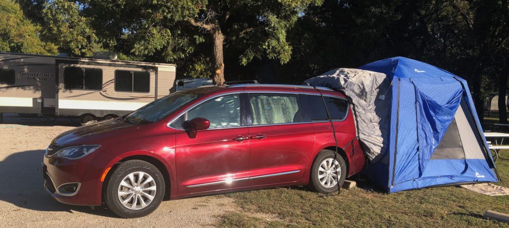 minivan camping with covered windows for privacy